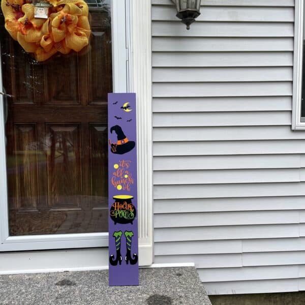 Welcome tricker or treaters with a Hocus Pocus porch sign.