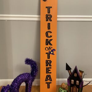 Indoor Trick or Treat leaner sign. Orange with purple witches hat.