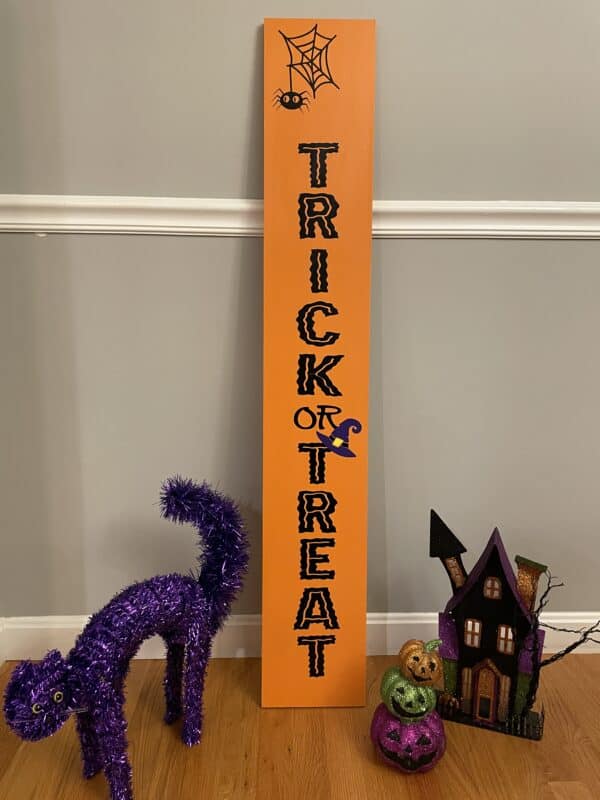 Indoor Trick or Treat leaner sign. Orange with purple witches hat.