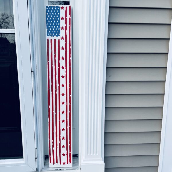 Outdoor porch sign of the American flag. Distressed look.