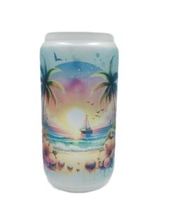 Beach tumbler with bamboo lid shaped like beer can. Sailboat in background.