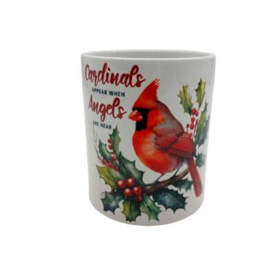 Coffee Mug with a Cardinal with red berries.