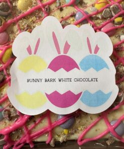 Sticker showing three pastel bunny silhouettes and the text ‘Bunny Bark White Chocolate’ over a pink-drizzled white chocolate bark surface.