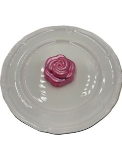 Blush pink rose-shaped chocolate covered Oreo on plate for Mother’s Day